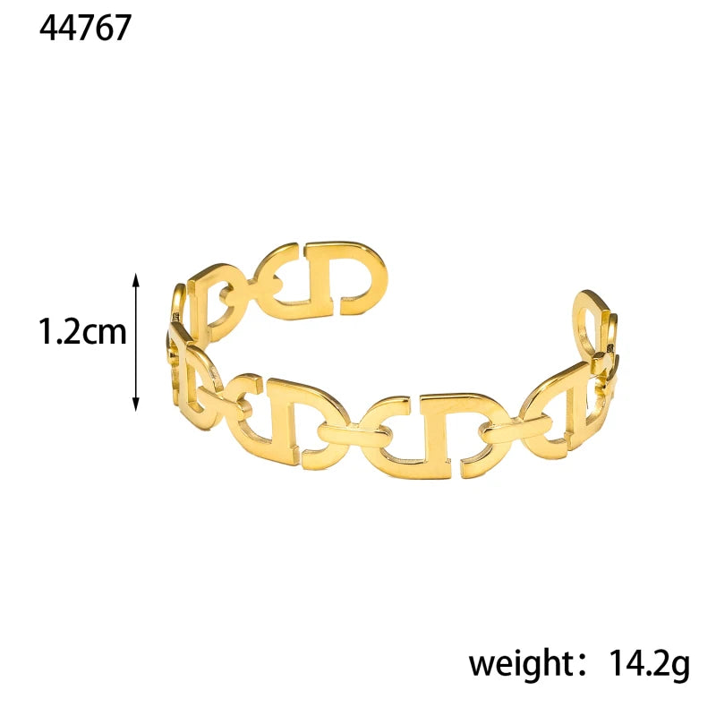 Titanium - Steel Gold - Plated C - Shaped Open - Ended Bangle. A Unique, Irregularly Spliced And Niche Accessory For Women.