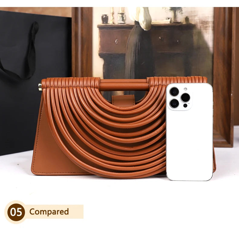 The 2025 new hand-held woven bag with lines is a unique, high-end, individual and fashionable handbag for women