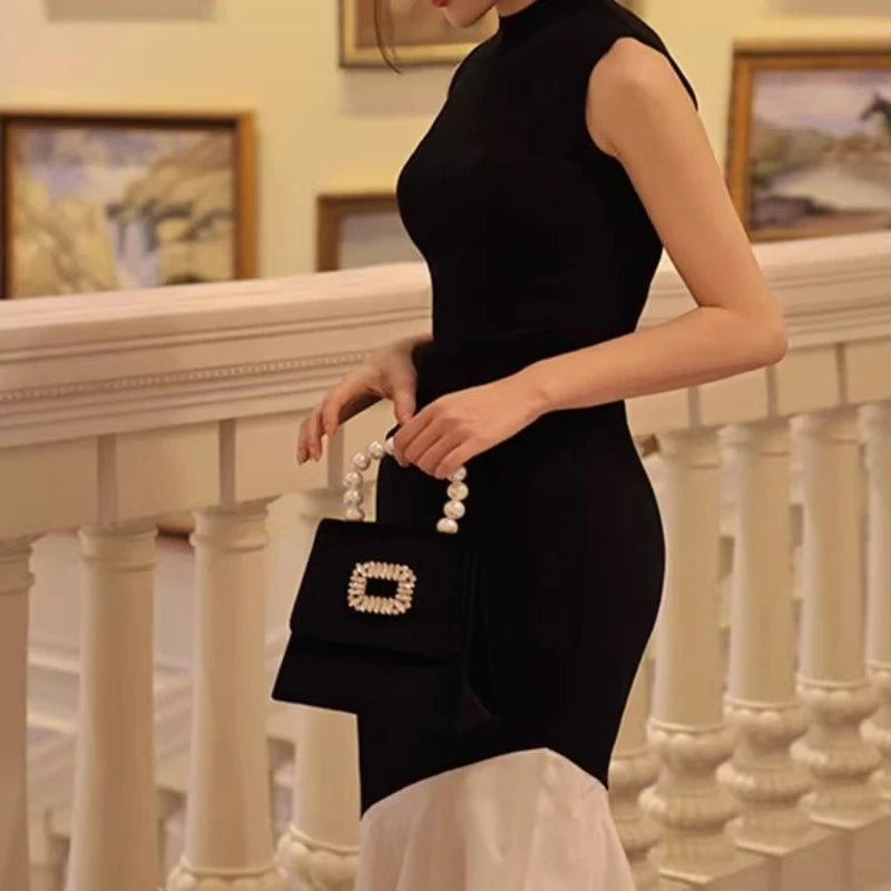 New French-style black dress for women, sleeveless, fitted with stitch detailing, elegant fishtail knitted long dress
