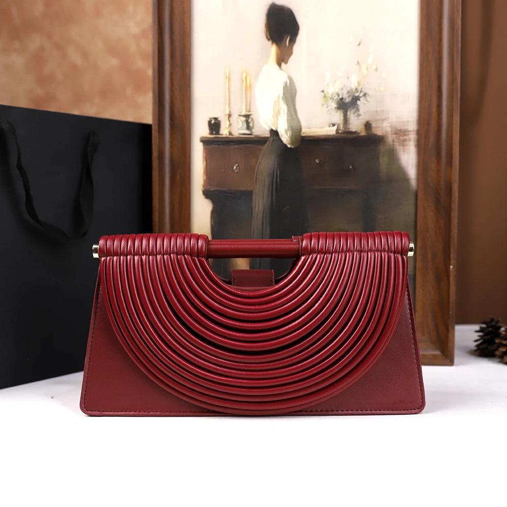 The 2025 new hand-held woven bag with lines is a unique, high-end, individual and fashionable handbag for women