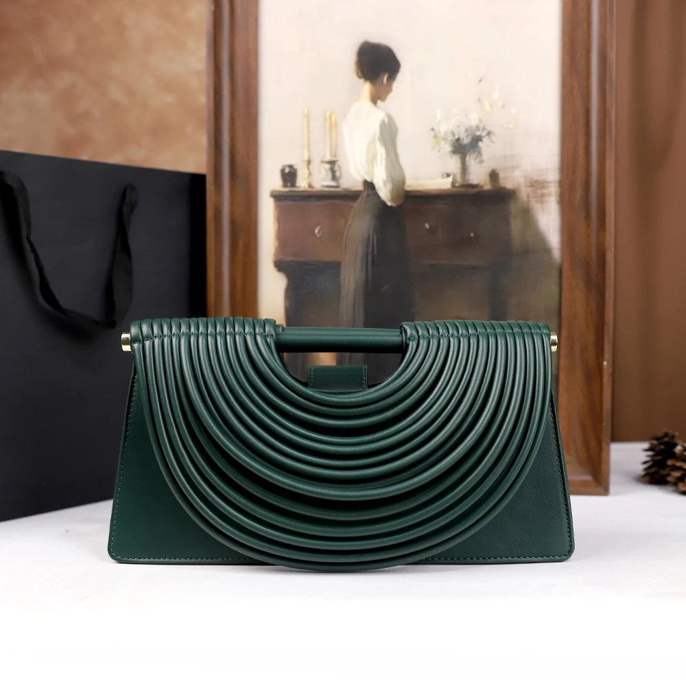The 2025 new hand-held woven bag with lines is a unique, high-end, individual and fashionable handbag for women