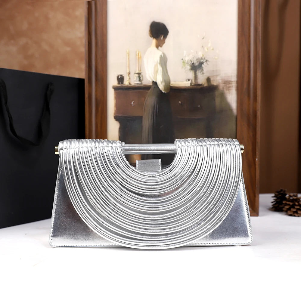 The 2025 new hand-held woven bag with lines is a unique, high-end, individual and fashionable handbag for women
