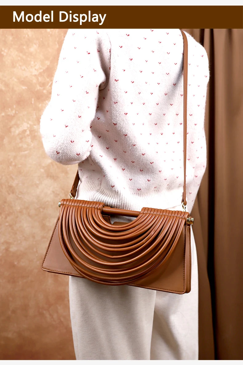 The 2025 new hand-held woven bag with lines is a unique, high-end, individual and fashionable handbag for women