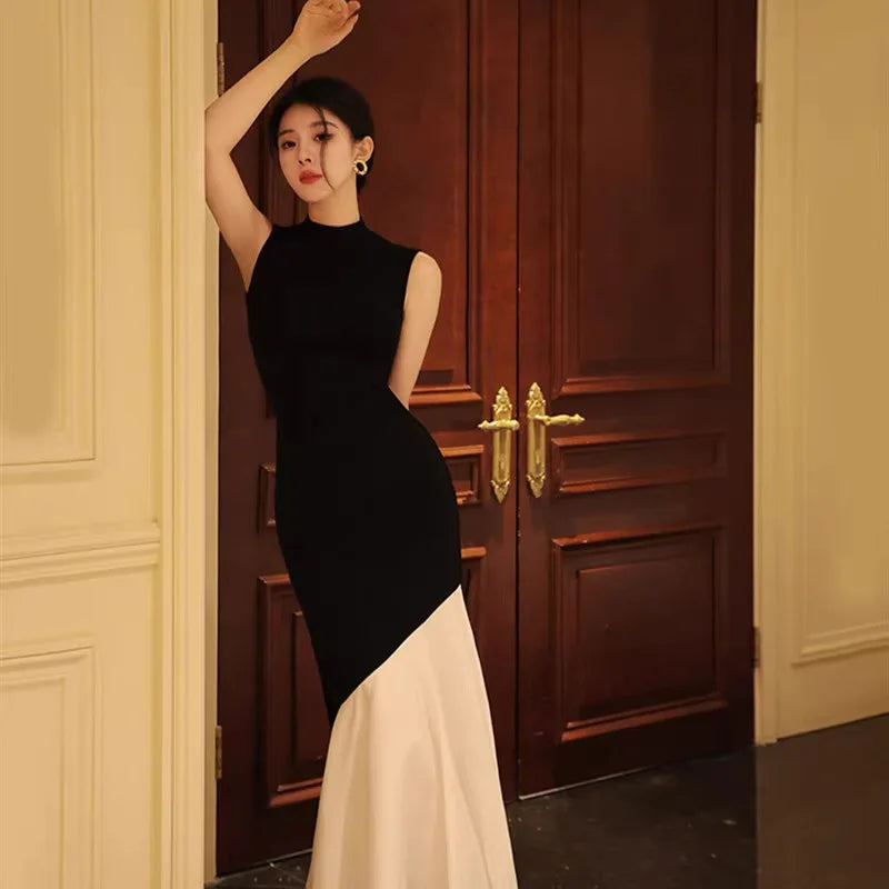 New French-style black dress for women, sleeveless, fitted with stitch detailing, elegant fishtail knitted long dress