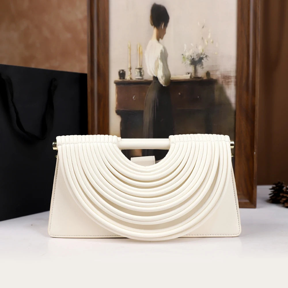 The 2025 new hand-held woven bag with lines is a unique, high-end, individual and fashionable handbag for women