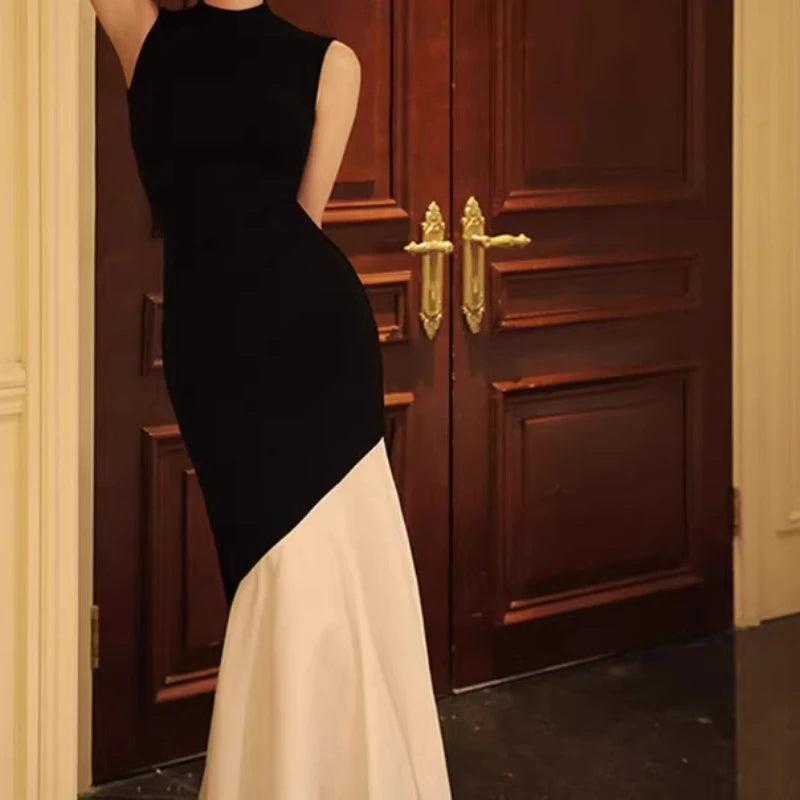 New French-style black dress for women, sleeveless, fitted with stitch detailing, elegant fishtail knitted long dress
